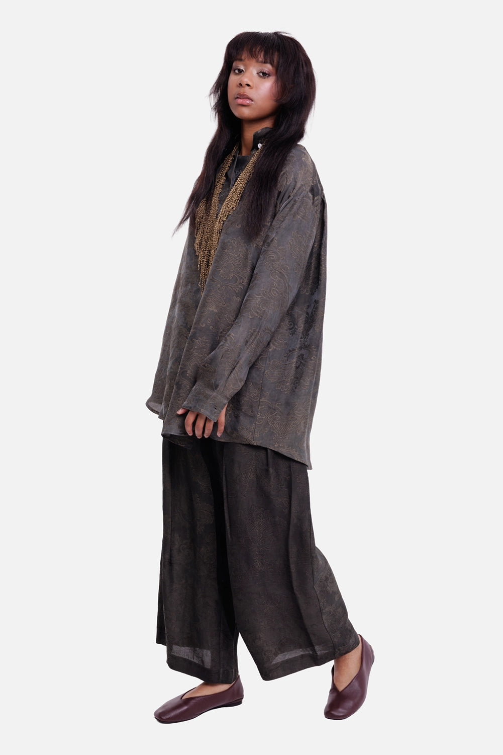 Uma Wang women's trousers in dark grey, full-length model view with wide cropped legs and tonal jacquard