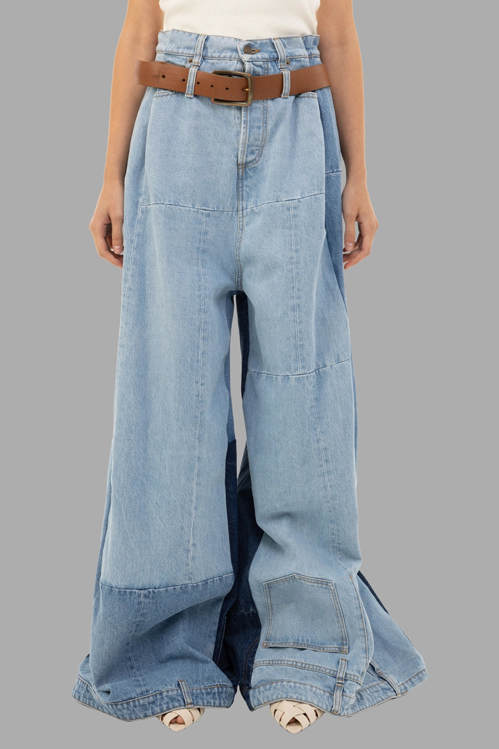 A.W.A.K.E. MODE women's jeans in Mid Blue, front view, high waist with belt and paneled patchwork
