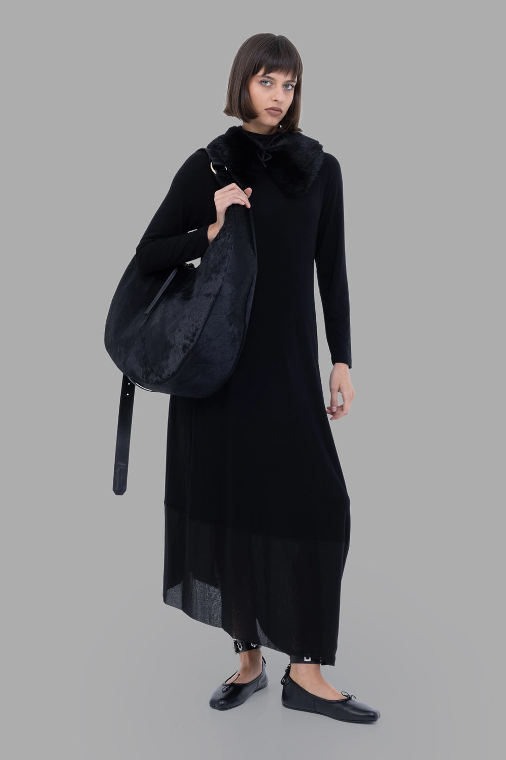 Gentry Portofino women jersey maxi dress in Nero, on-model full length, mock neck, sheer hem panel
