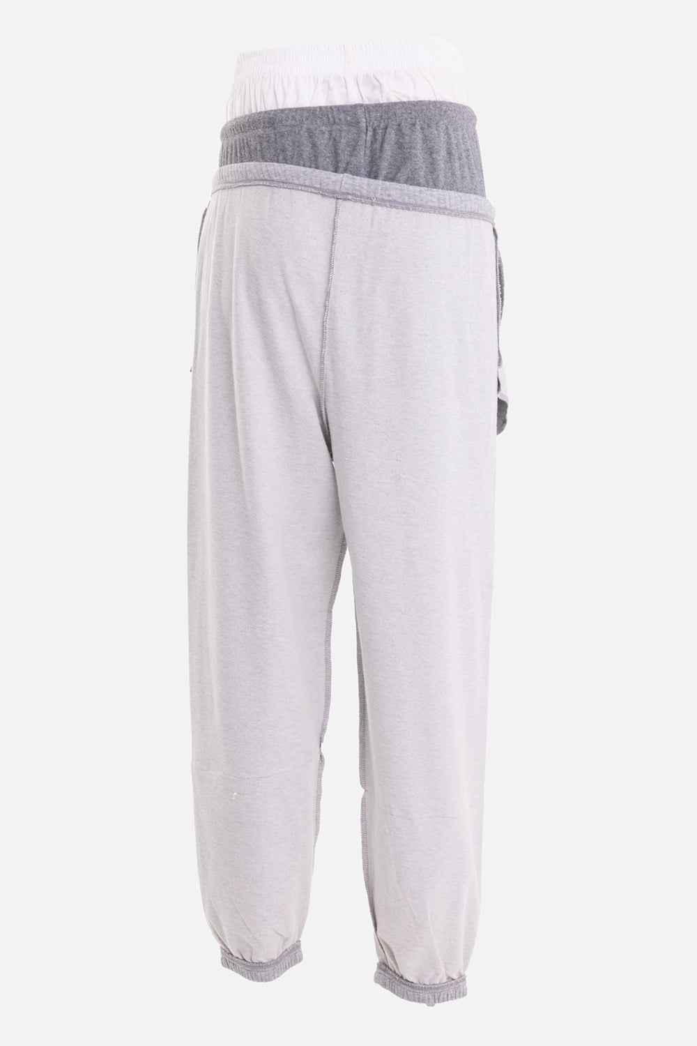 Natasha Zinko women's jogger pants in grey, front view, layered waistband and large patch pockets