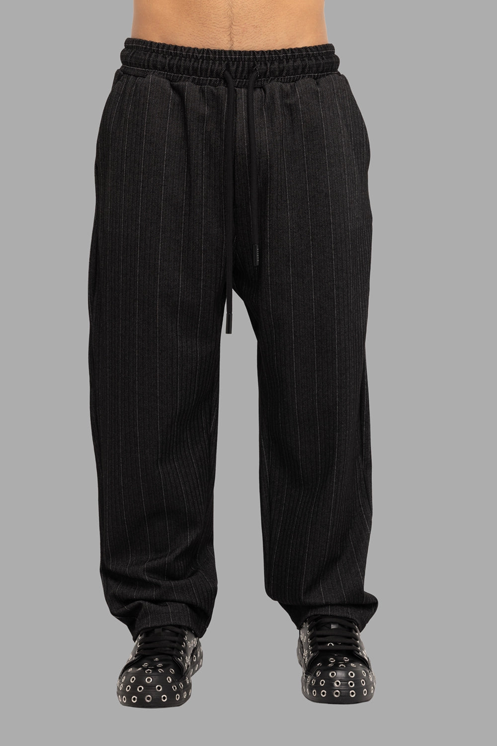 Gaelle Paris men’s jogger trousers in black pinstripe, front view, long drawcord and relaxed straight leg