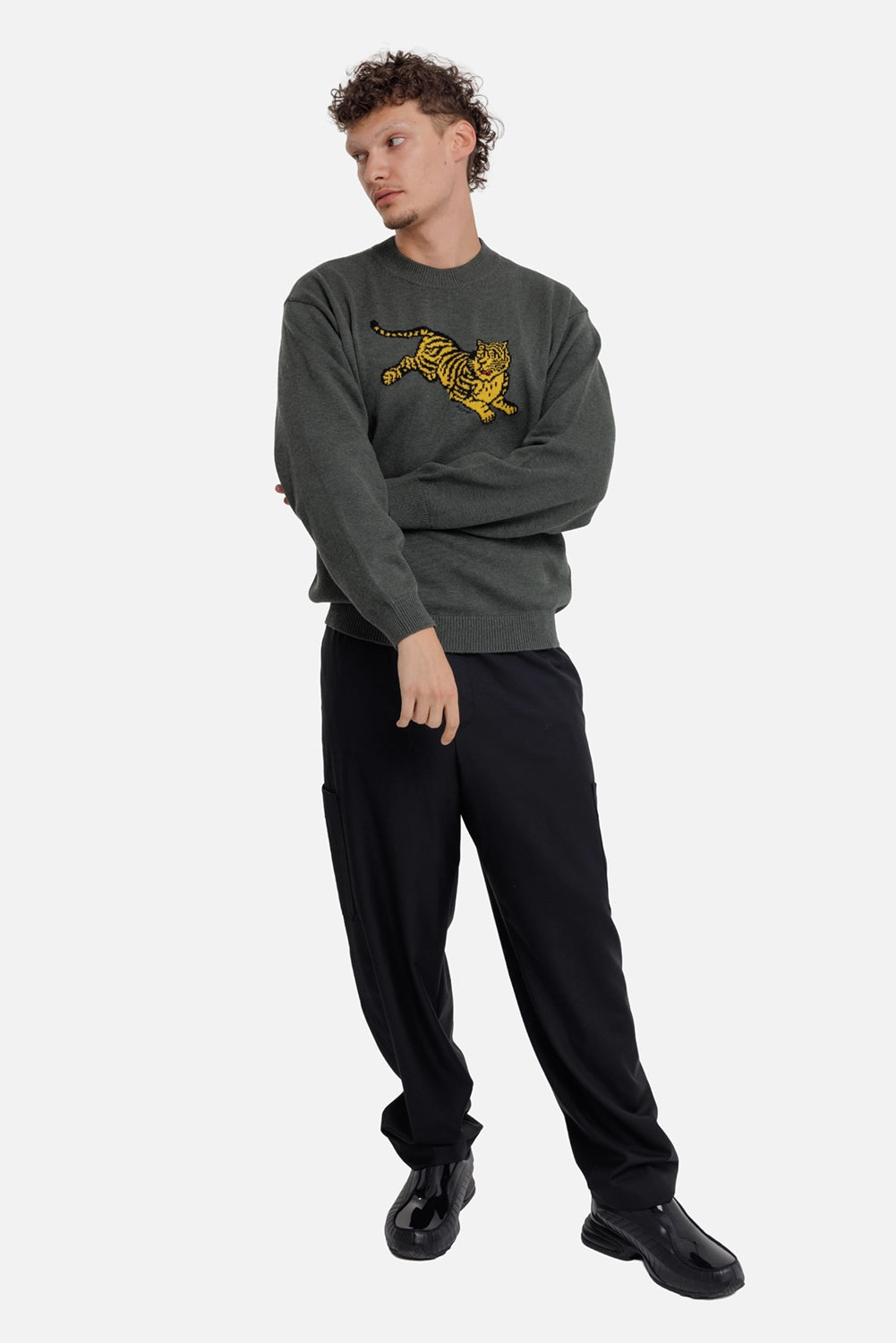 Kenzo men's dark khaki Jumping Tiger sweater, full-length on-model view with relaxed fit and tiger intarsia