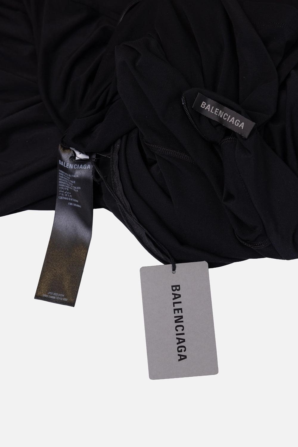 Pre-owned Balenciaga women's jumpsuit in black, brand label close-up, Balenciaga hang tag attached.