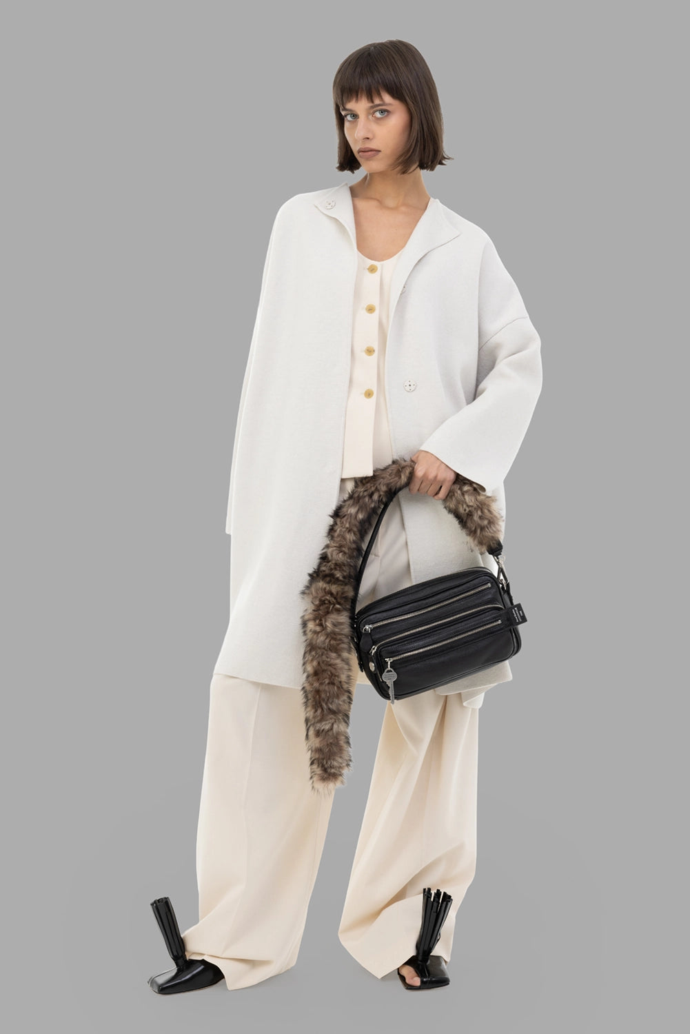 Gentry Portofino women knit coat in Stucco, on-model full length, collarless design, drop shoulders