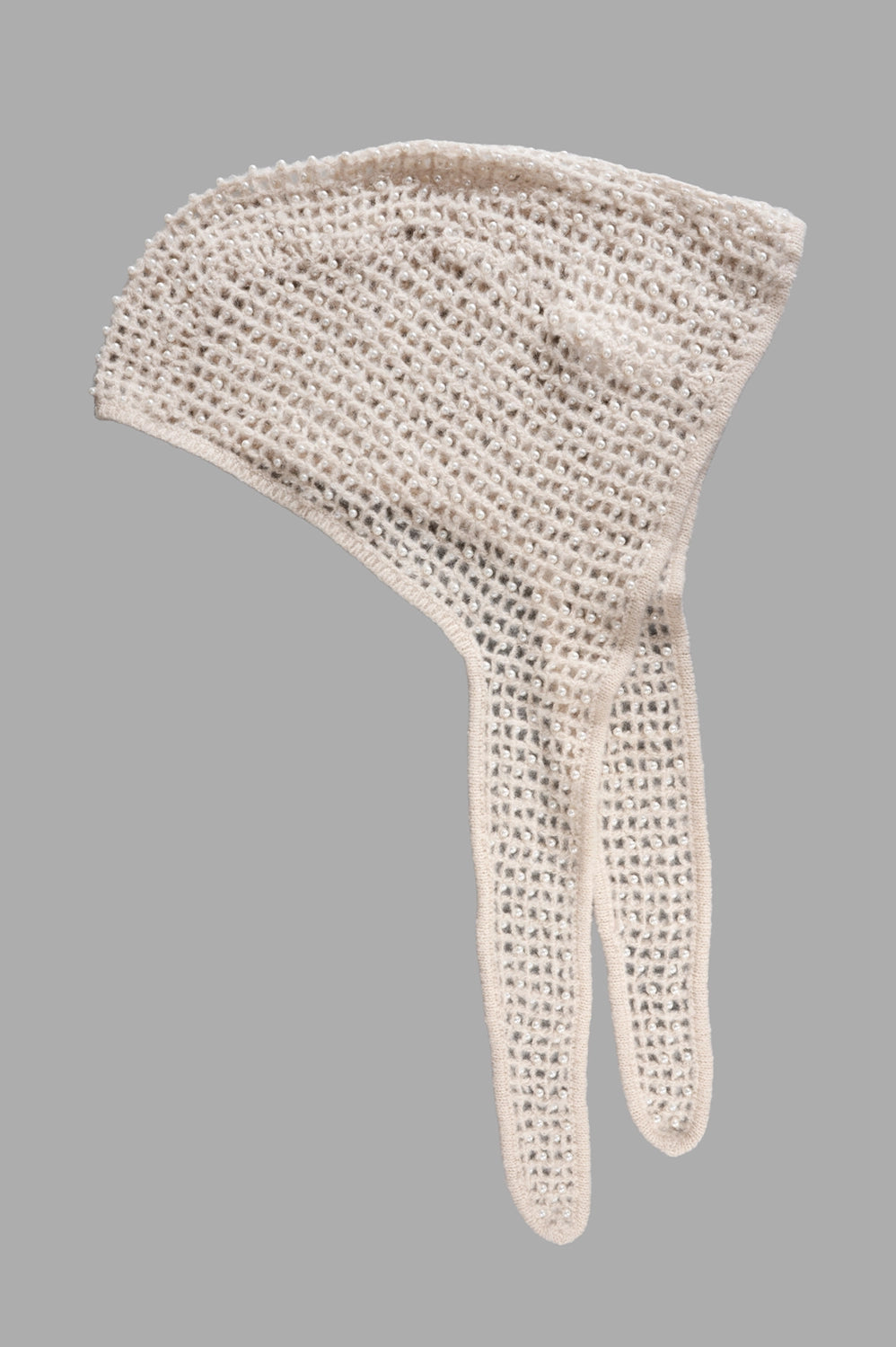 Full-length view of pearl-embellished knit hood in oyster gray with split scarf ties and airy open stitch