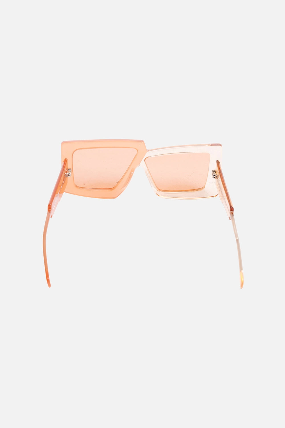 Pre-owned Kuboraum asymmetric geometric sunglasses in translucent peach, angled view