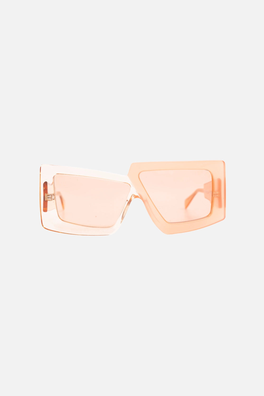 Pre-owned Kuboraum asymmetric geometric sunglasses in translucent peach with tinted lenses, front view