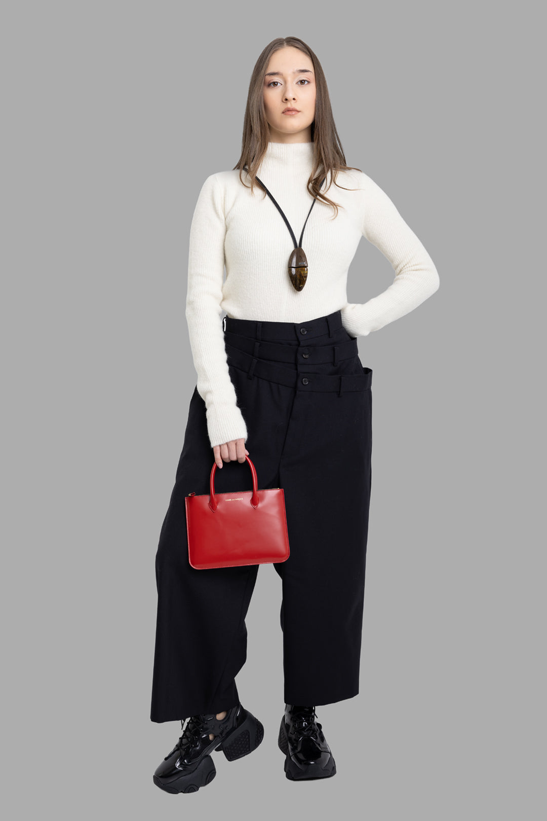 Noir Kei Ninomiya women's black layered waist trousers, full-length front on model with triple waistband and cropped wide leg