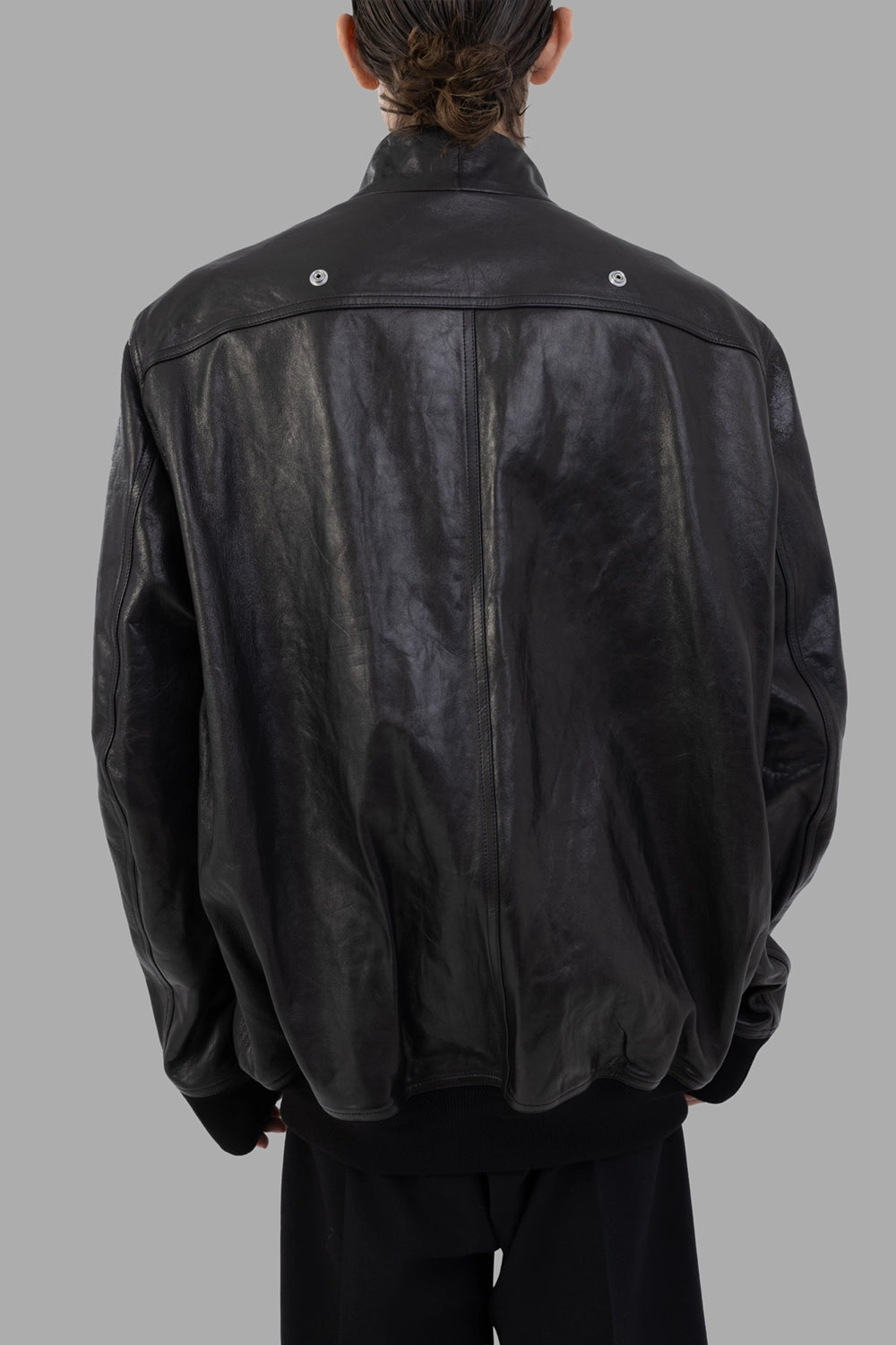 Rick Owens leather flight jacket in black, back view, yoke snaps and ribbed hem