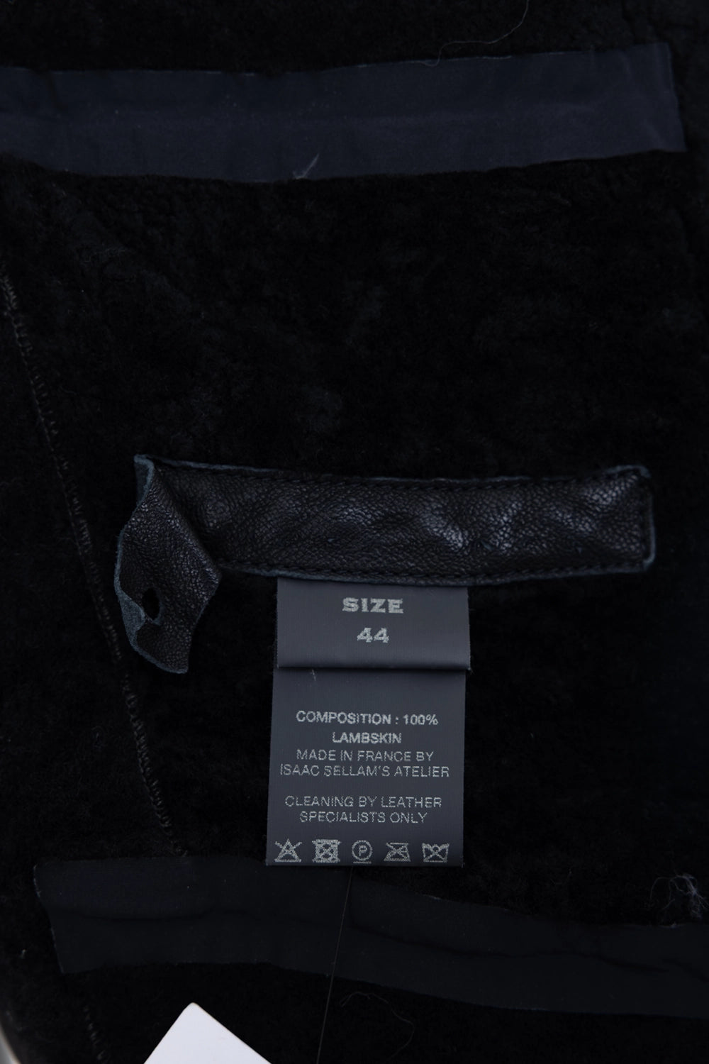 Pre-owned Isaac Sellam leather jacket in black, interior label close-up, size tag and lambskin composition label