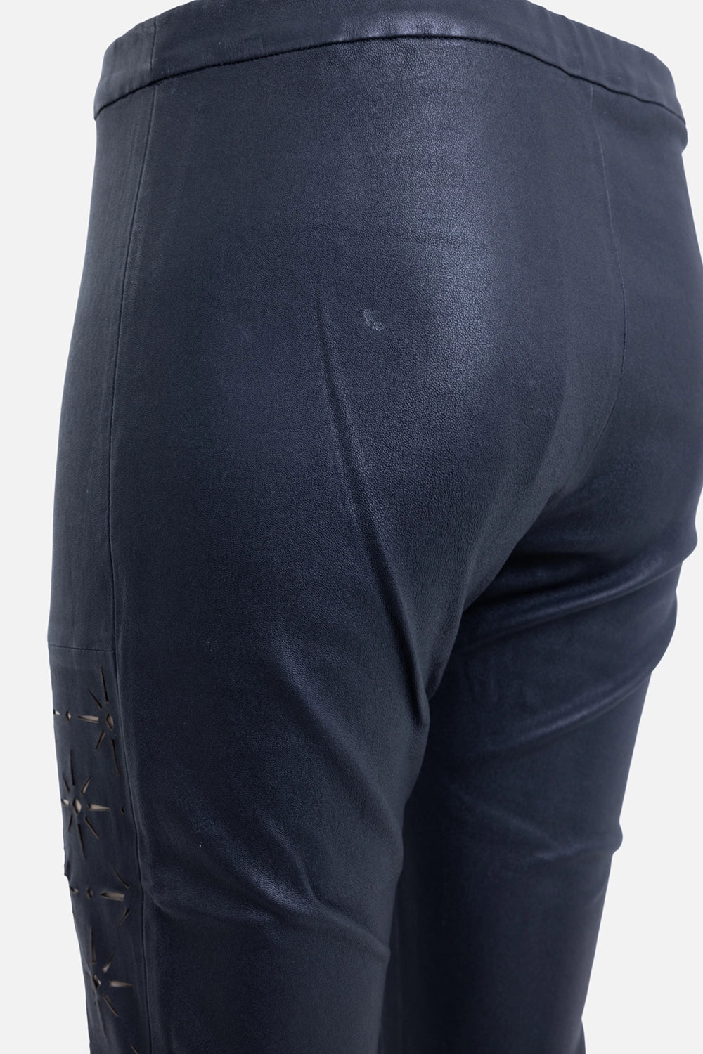Pre-owned Haider Ackermann women's leather leggings in black, side detail view, laser-cut star motif and seam line