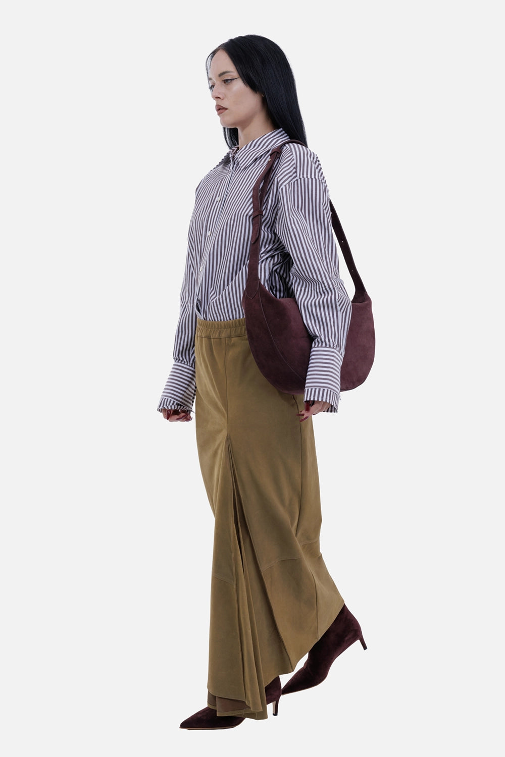 Gentryportofino women's camel leather maxi skirt, on-model view with asymmetric hem and front opening