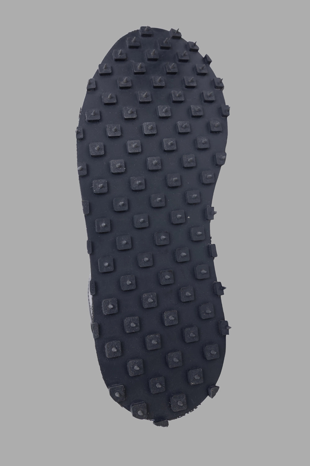 Shoto unisex leather low-top sneakers in black, outsole detail, square-stud tread pattern