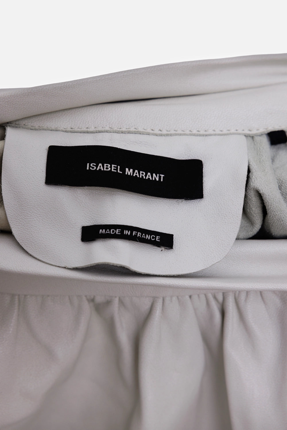 Isabel Marant women's leather top in white, label detail, black brand tag and leather facing
