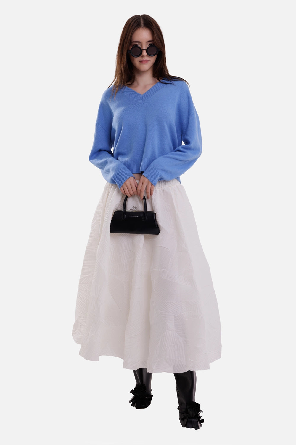 Anine Bing women's sweater in storm blue, full-length model view with V-neck, dropped shoulders and ribbed cuffs