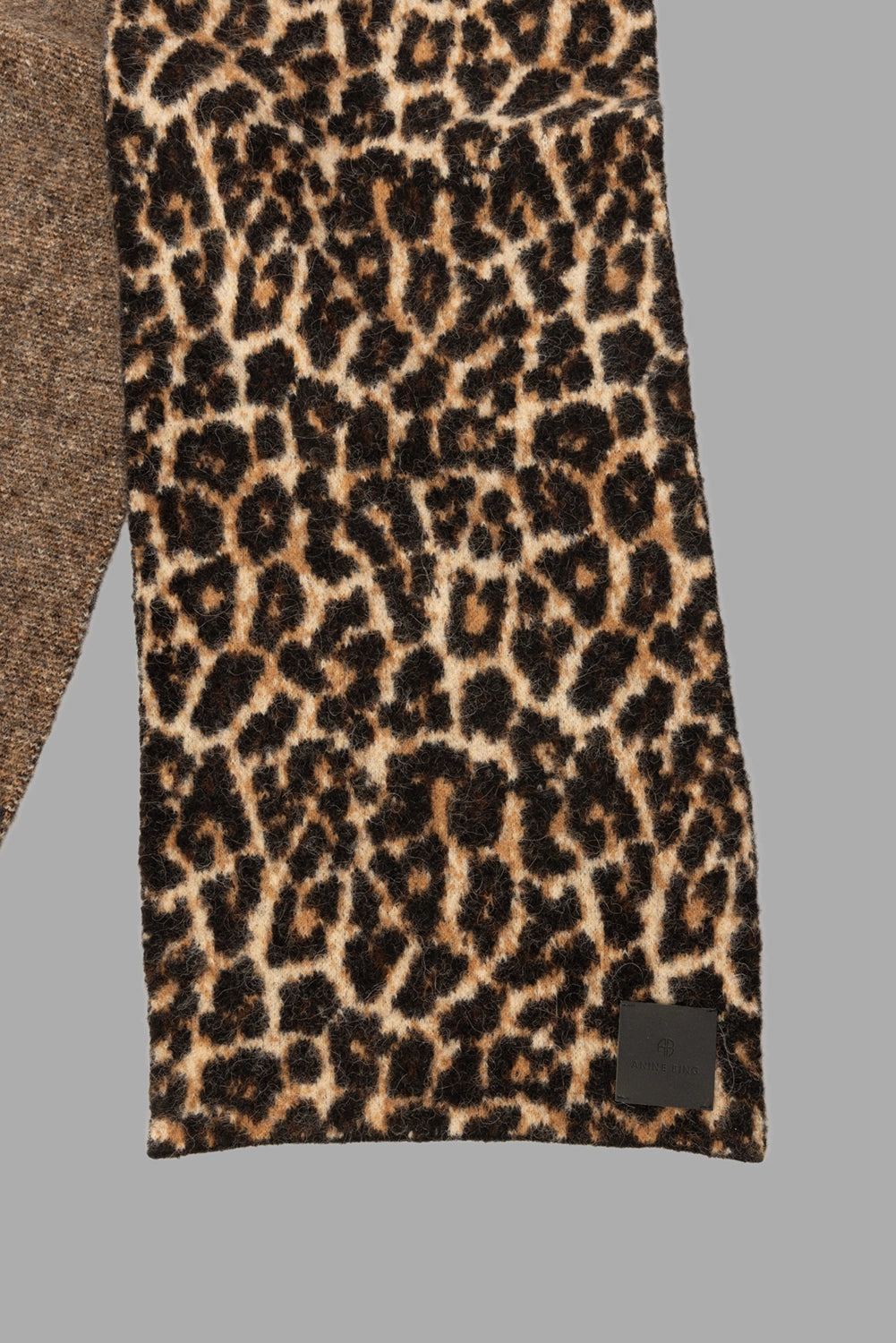 ANINE BING women leopard scarf in black and brown, fabric close-up showing fuzzy jacquard knit