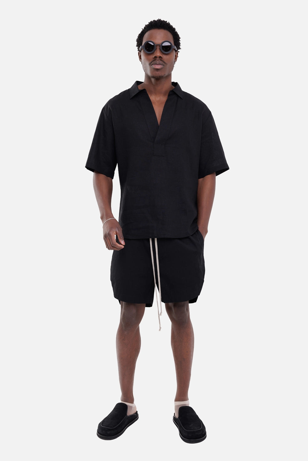 Gaëlle Paris men's linen shirt in black, on-model full-length view, open collar and short sleeves