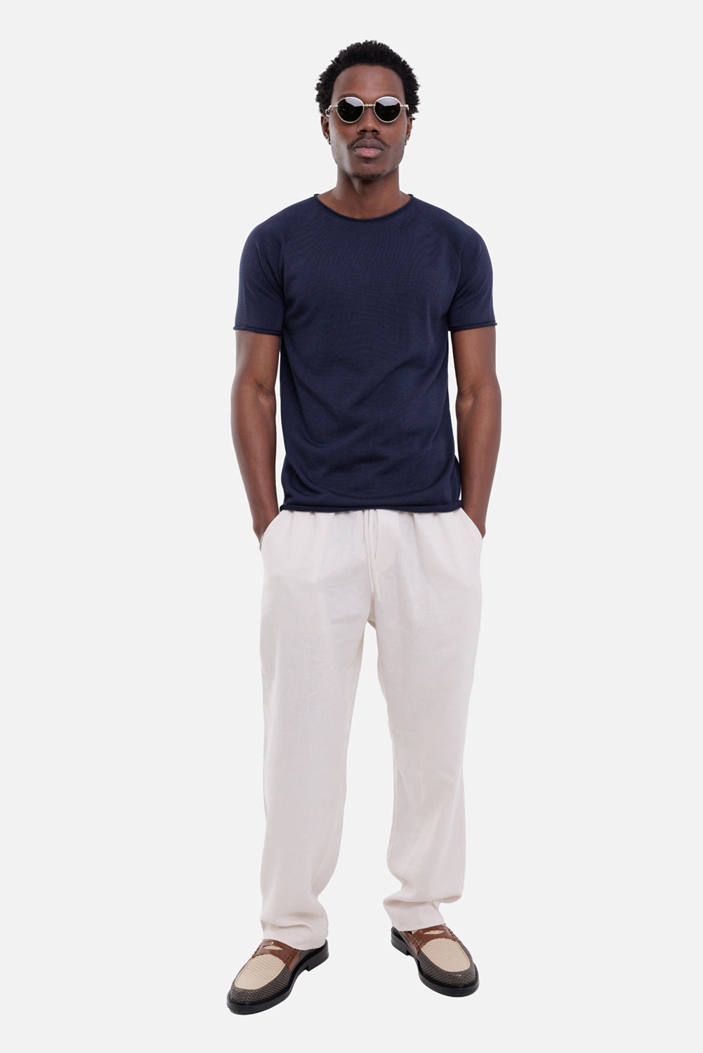 Gaëlle Paris men's linen trousers in beige, on-model full-length view, elastic drawstring waist and straight leg