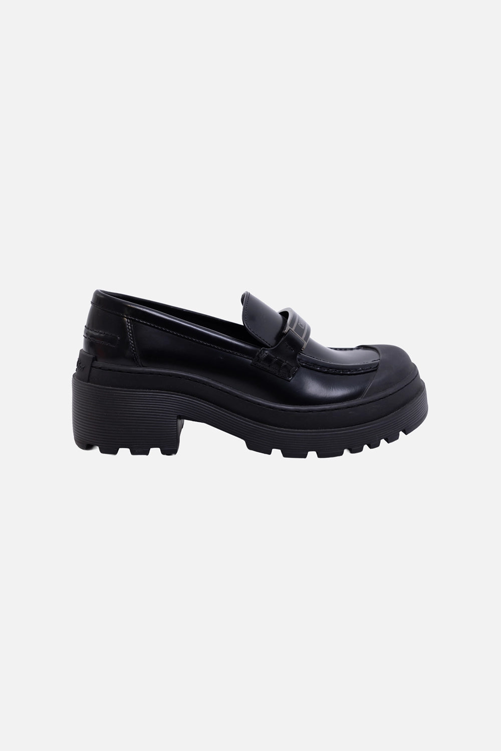 Pre-owned Christian Dior women's loafers in black, side view, lug sole and logo plaque strap