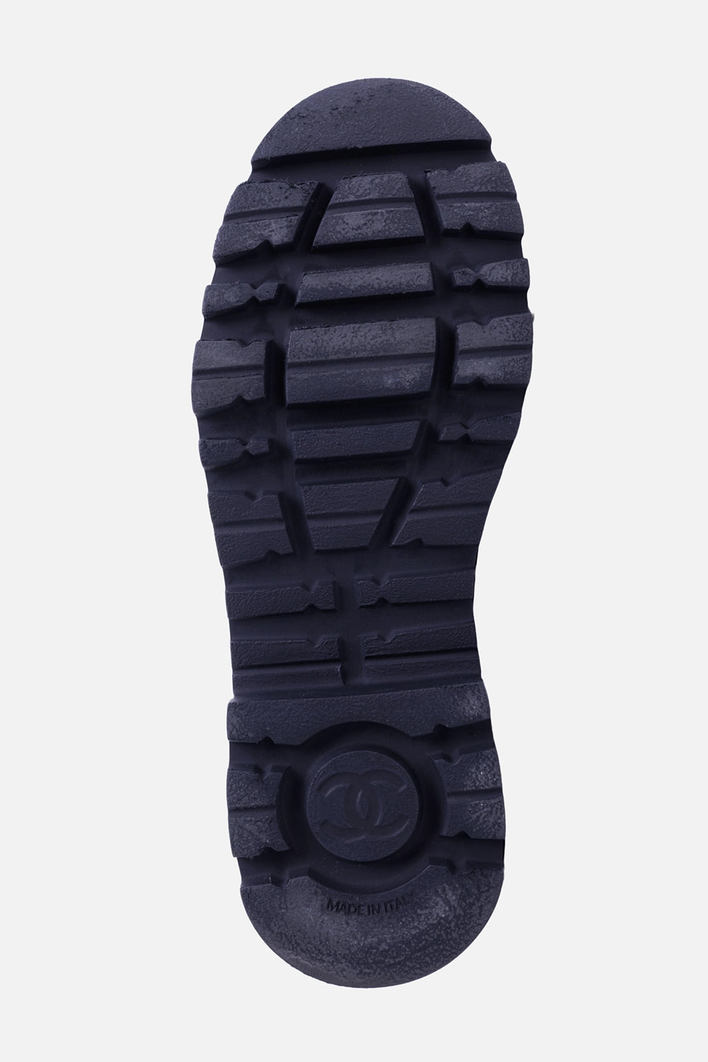 Chanel women's black leather loafers, sole view with deep lug tread and circular CC emblem
