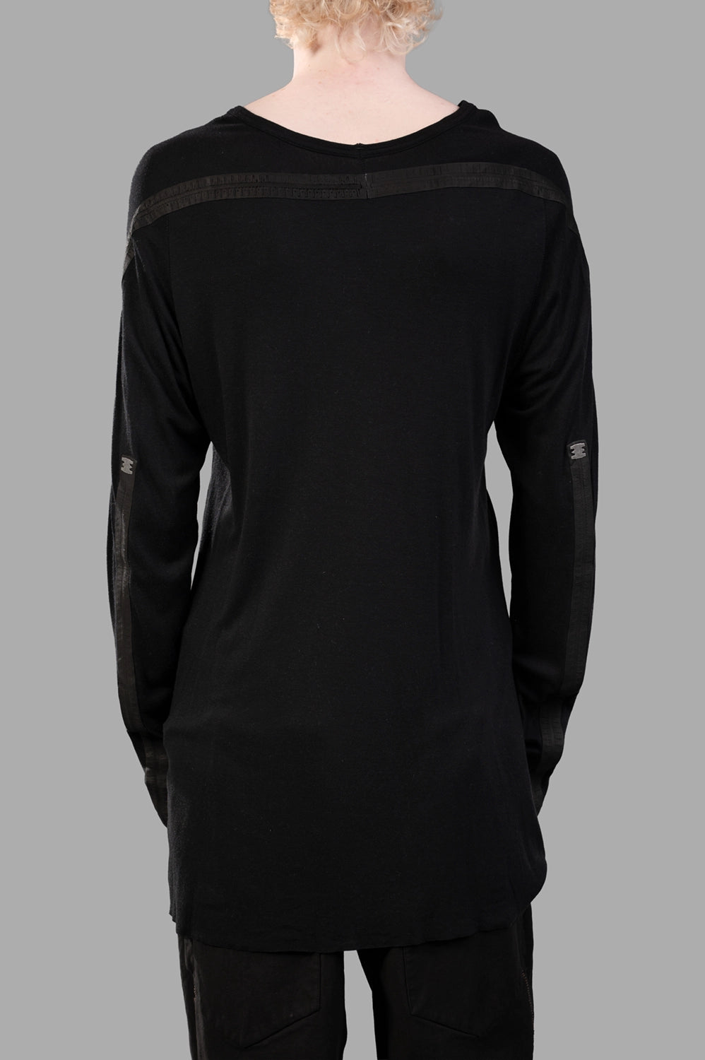 69 by Isaac Sellam long-sleeve t-shirt in black, back view, horizontal leather spines and staple tabs