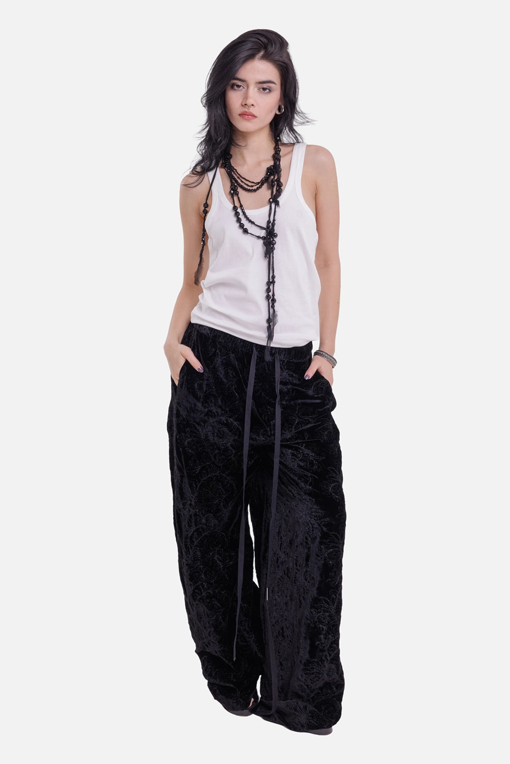 Ann Demeulemeester women's lounge pants in black, model view with ribbon ties and floor-skimming wide legs