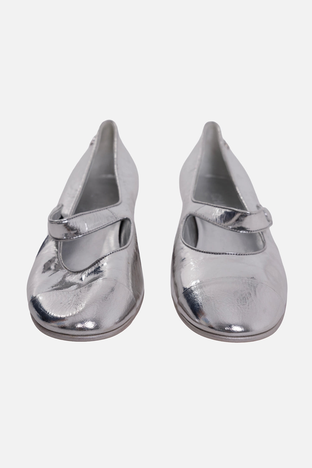 Chanel women's Mary Jane flats in silver, front view, strap closure and rounded cap toes
