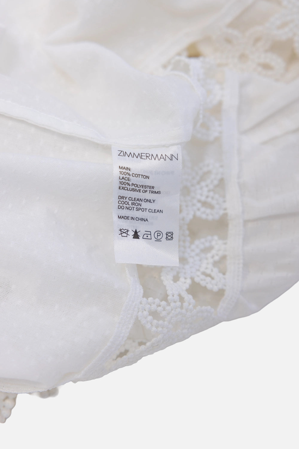 Pre-owned Zimmermann maxi dress in white, care label close-up, fiber content and care instructions