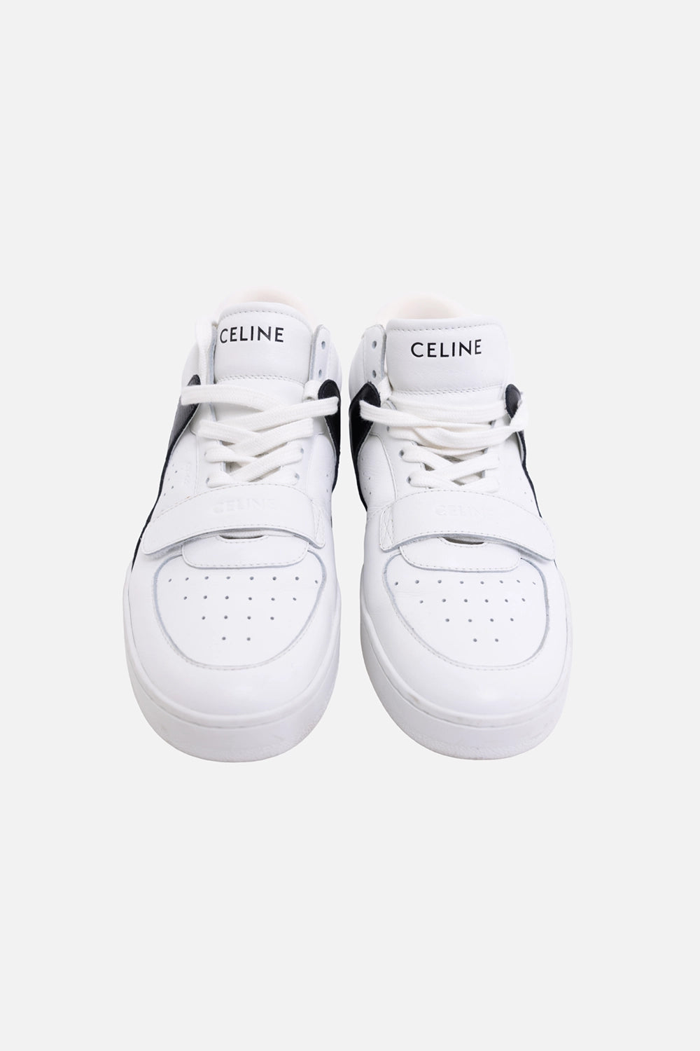Pre-owned Celine unisex CT-02 mid-top sneakers in white and black, front view, perforated toe and strap over laces.