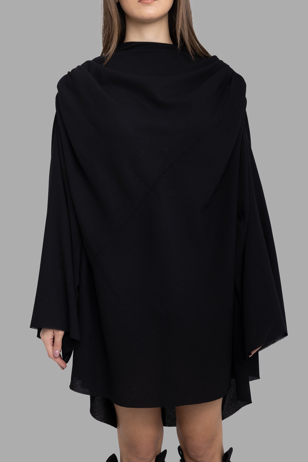 Rick Owens women's black Claudette mini dress, on-model half-length view showing draped wool and open sleeve sides