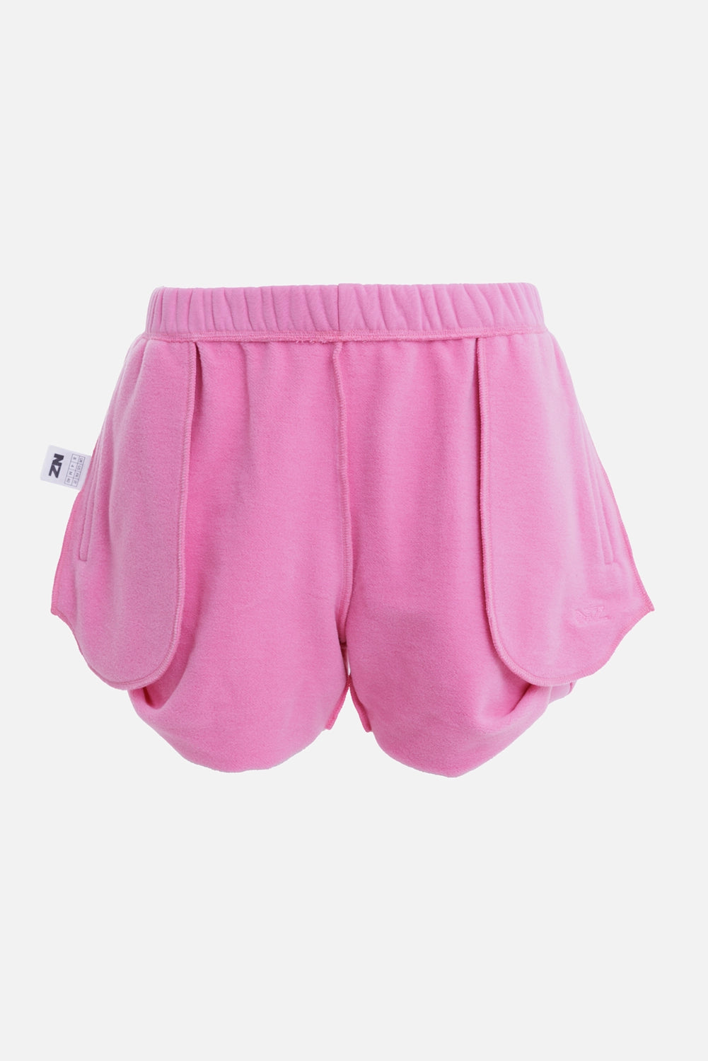 Natasha Zinko women's pink mini shorts, front view with elastic waist and oversized curved panels

