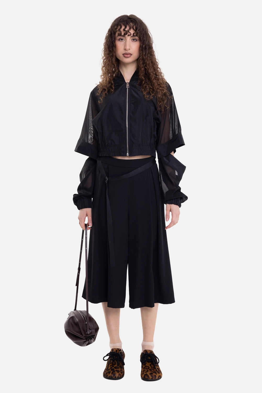 La Haine Inside Us women's bomber jacket in black, on-model full-length view, cropped hem and long sheer sleeves
