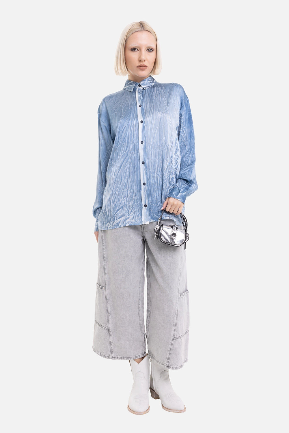 Avant Toi women's silk shirt in light blue, on-model full-length with relaxed long sleeves and dark buttons