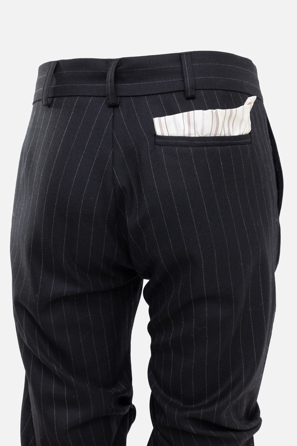 Natasha Zinko women's pinstripe pants in black/white, pocket detail, striped fabric insert at back welt pocket.