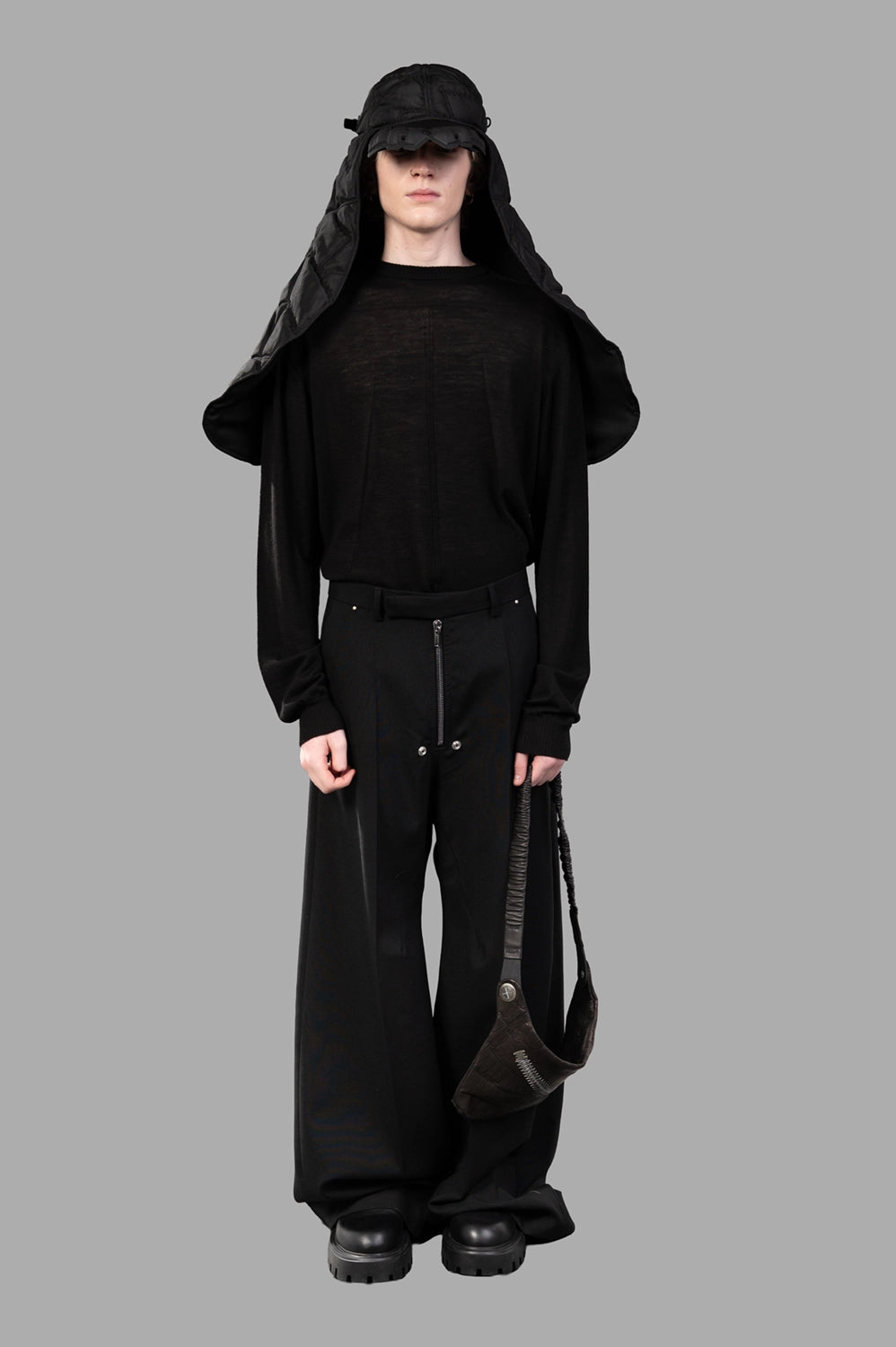 Rick Owens wide-leg pants in black wool‑blend, on‑model full length, front pleat and relaxed silhouette