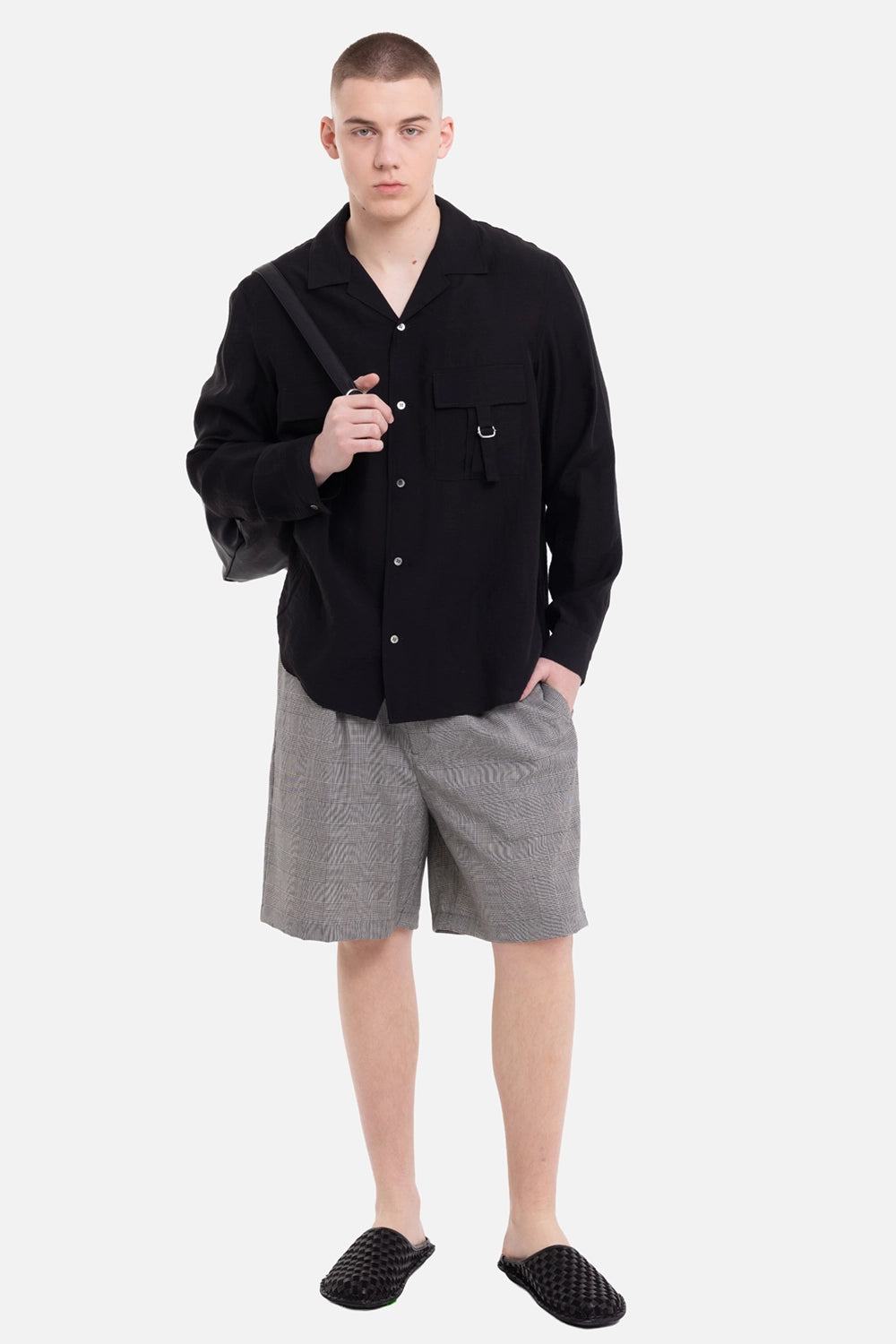 ATTACHMENT men's open-collar shirt in black, on-model full-length view, relaxed drape and utility pockets