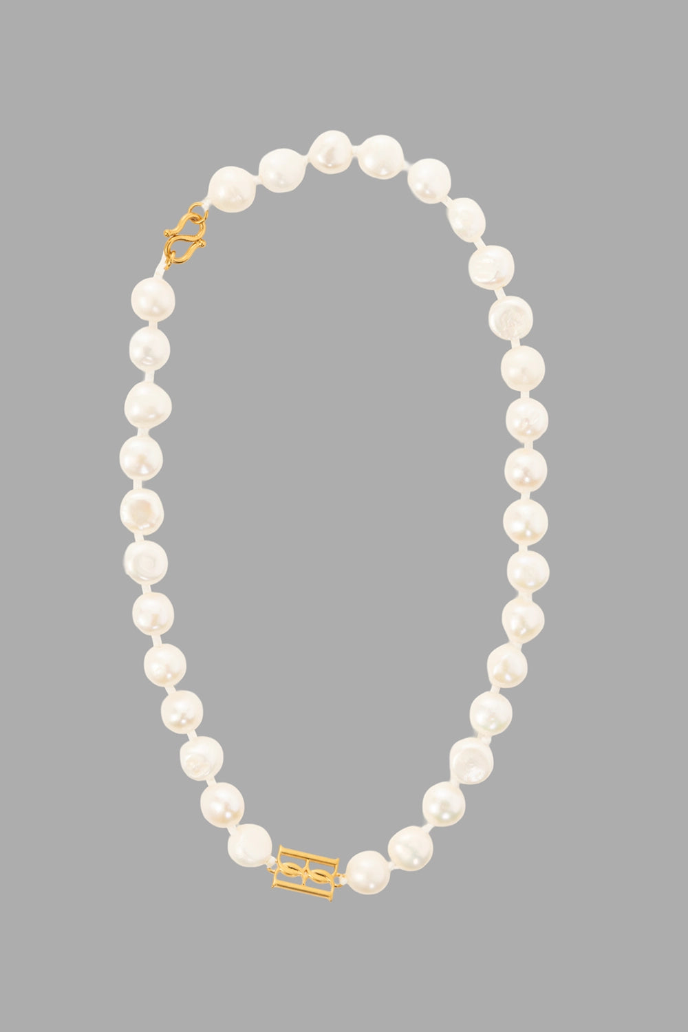 By Malene Birger women's pearl necklace in Soft White, front view, baroque freshwater pearls with gold monogram clasp.