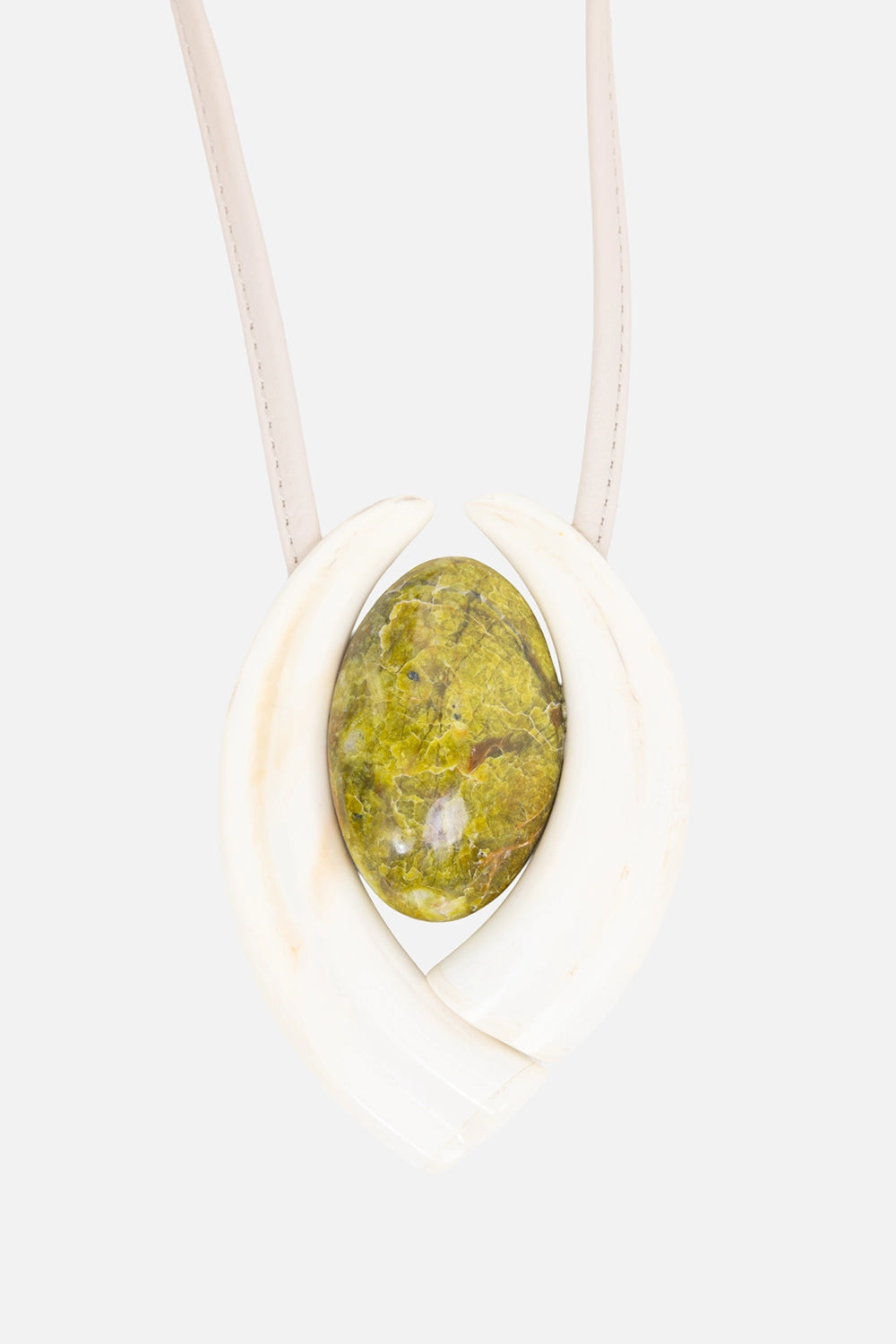 Not confirmed unisex pendant necklace in ivory/green, pendant close-up, oval serpentine cabochon framed by tusk curves