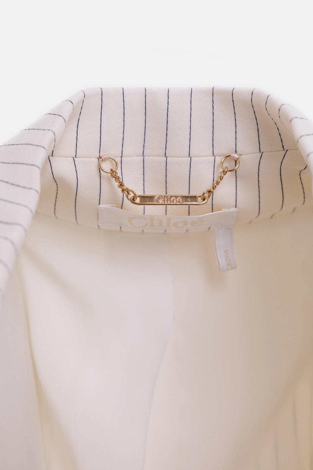 Chloé women's pinstripe longline jacket in buttercream, logo detail, gold chain tab inside collar