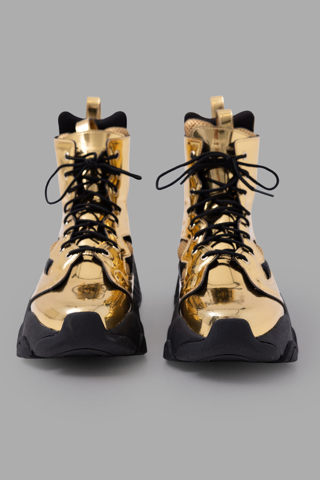 Noir Kei Ninomiya x Reebok unisex gold cutout platform boots, front view with black laces and sculpted sole