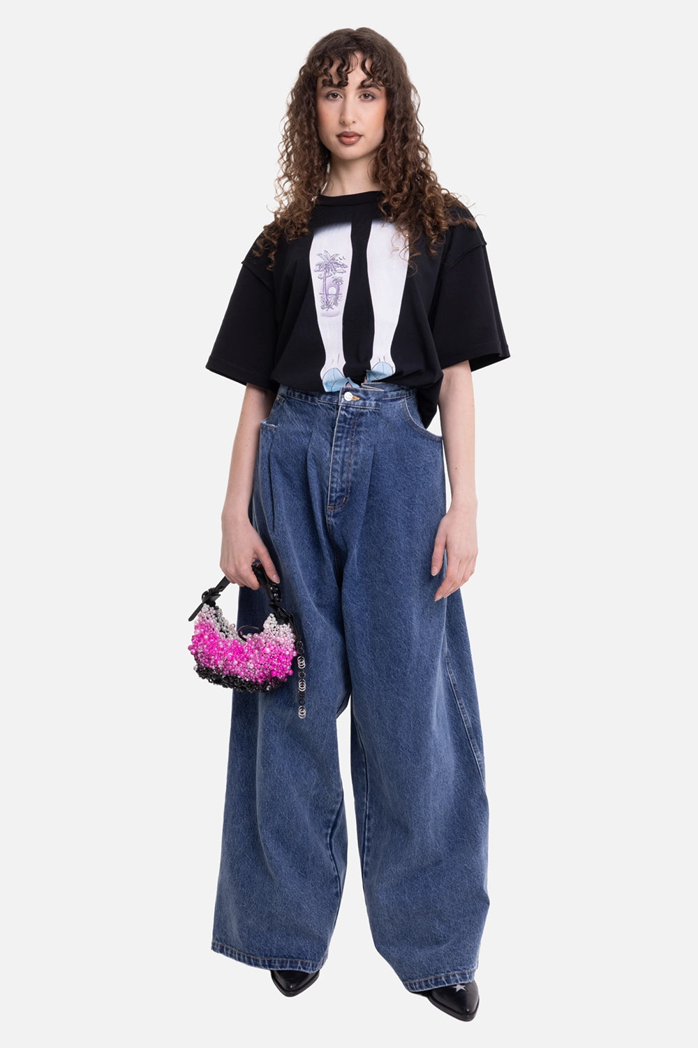 Natasha Zinko unisex pleated jeans in dark wash, on-model full-length view, high waist and wide legs