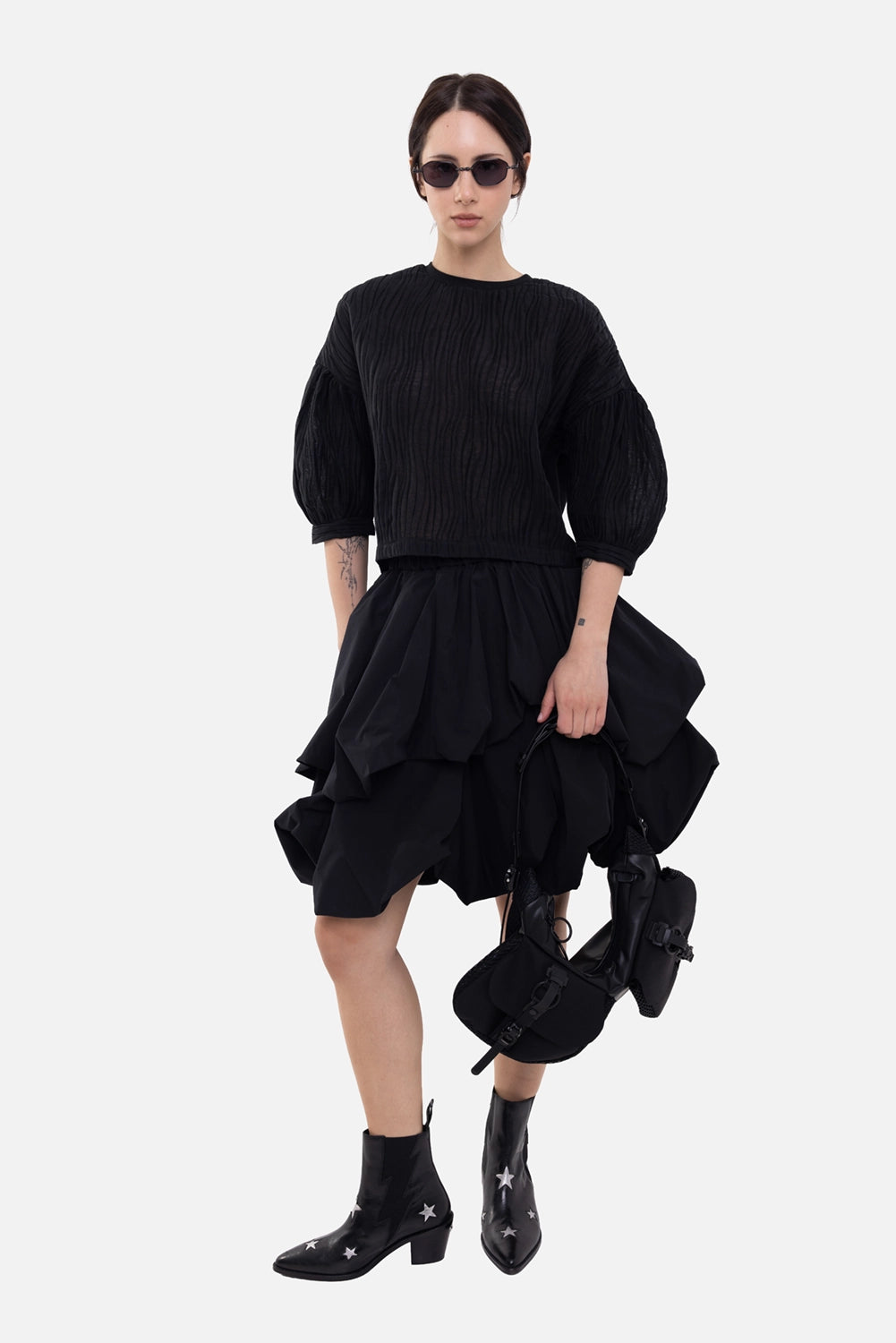 Masnada women's cropped top in black, on-model full-length, pleated puff sleeves and cropped hem
