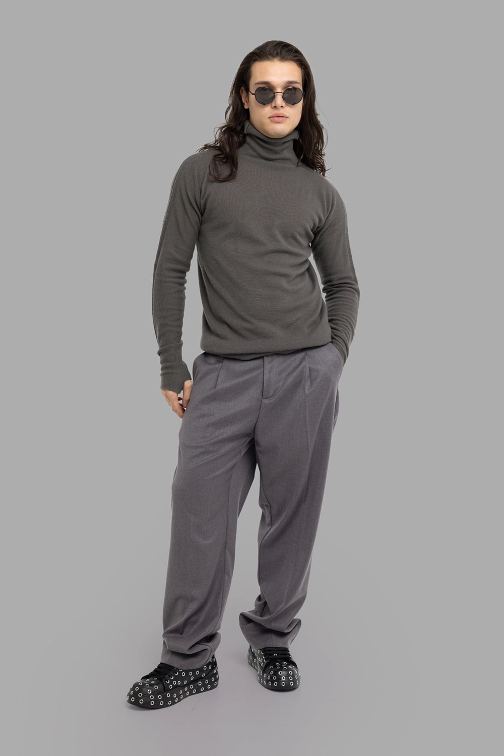 Gaëlle Paris men’s pleated trousers in grey, on-model full length, wide leg and high waist.