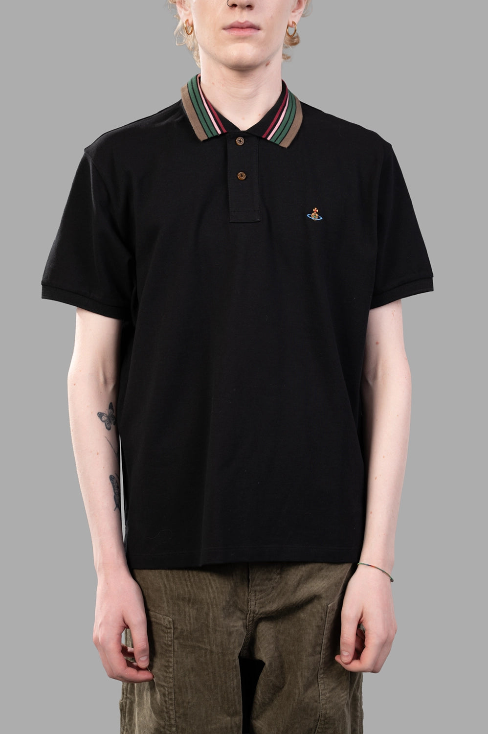 Vivienne Westwood polo shirt in black, on-model half length, two-button placket and striped collar