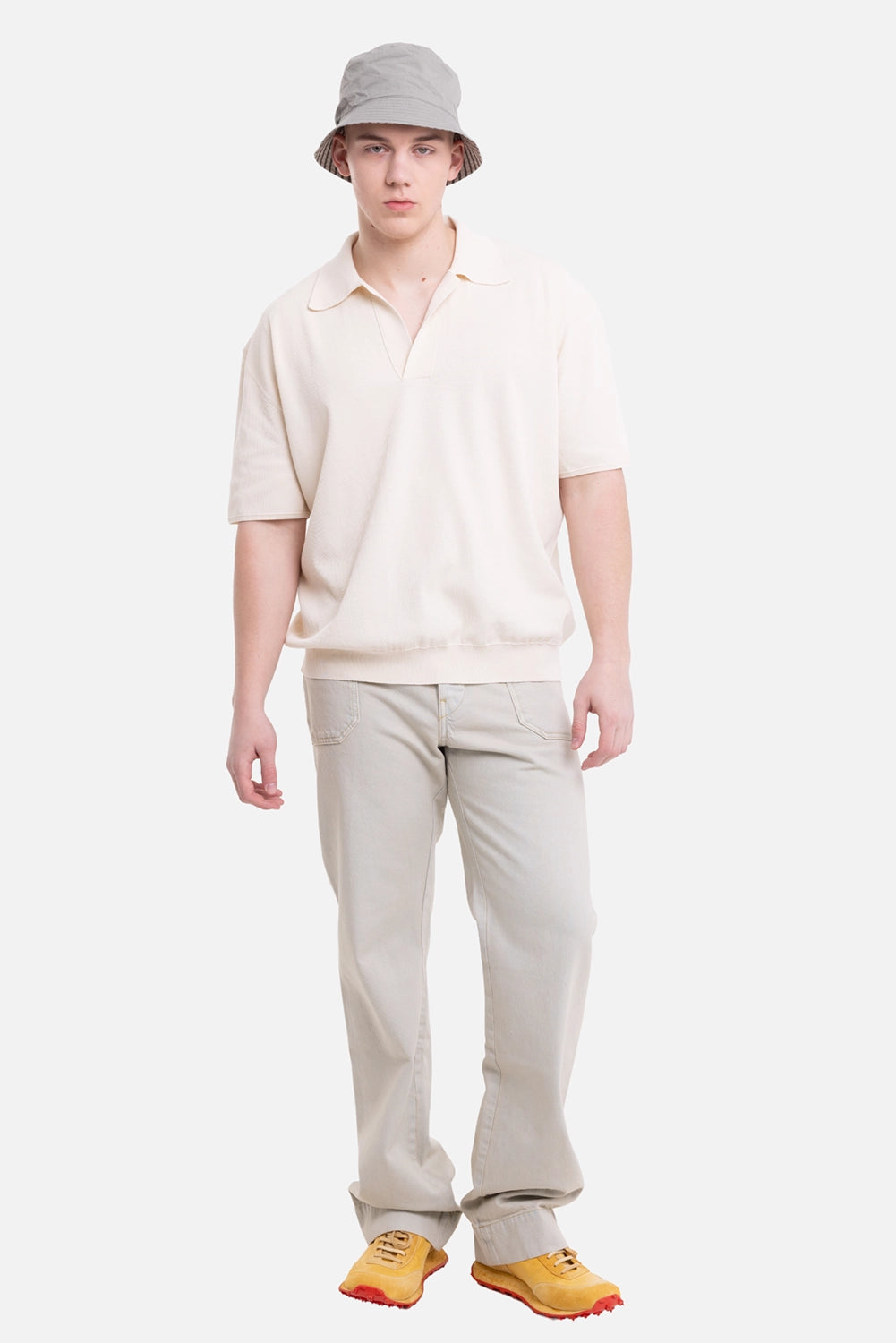 Uma Wang men's polo shirt in off white, on-model full-length view, relaxed fit and open placket