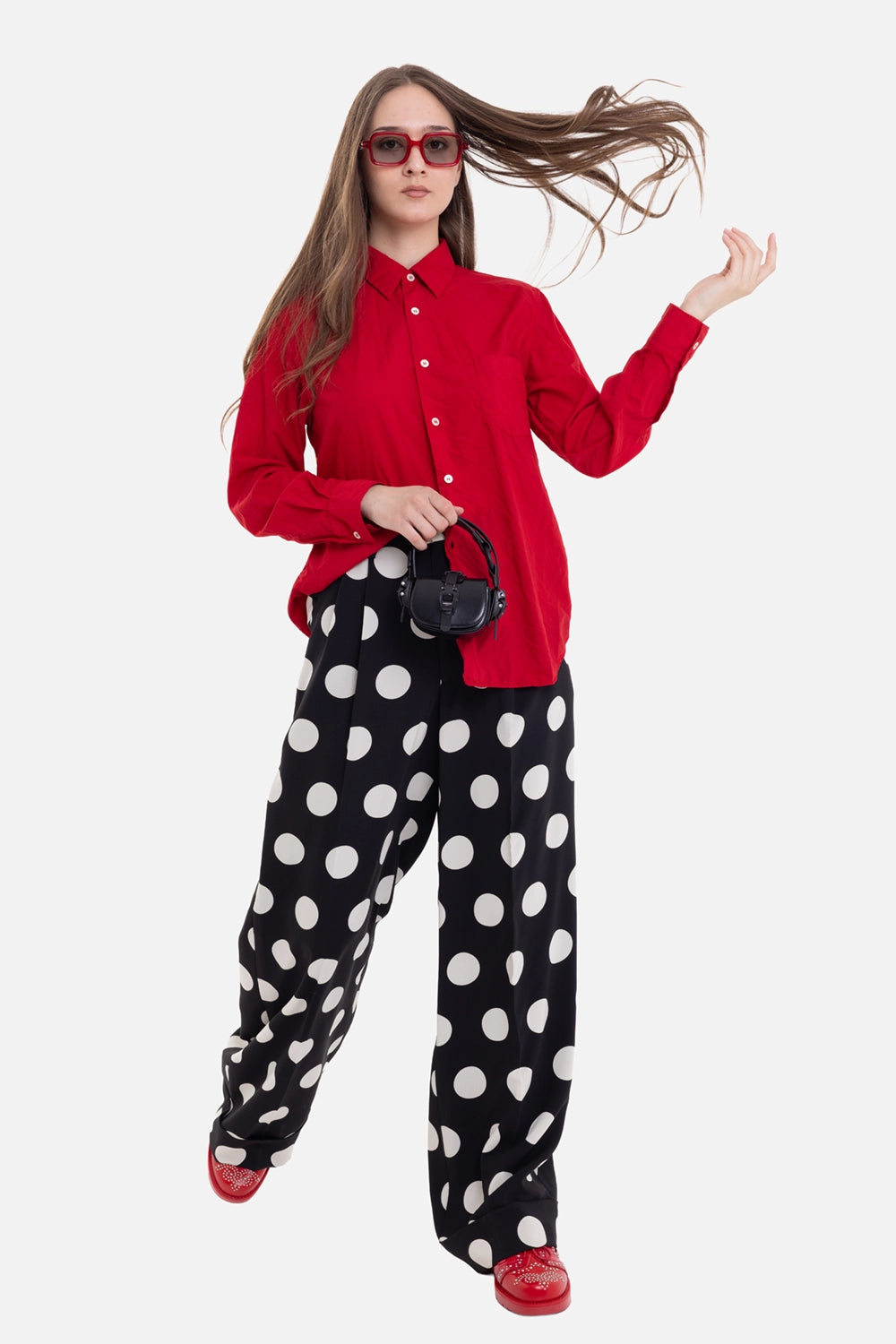 Comme des Garçons women's shirt in red, on-model full-length view, buttoned cuffs and curved hem