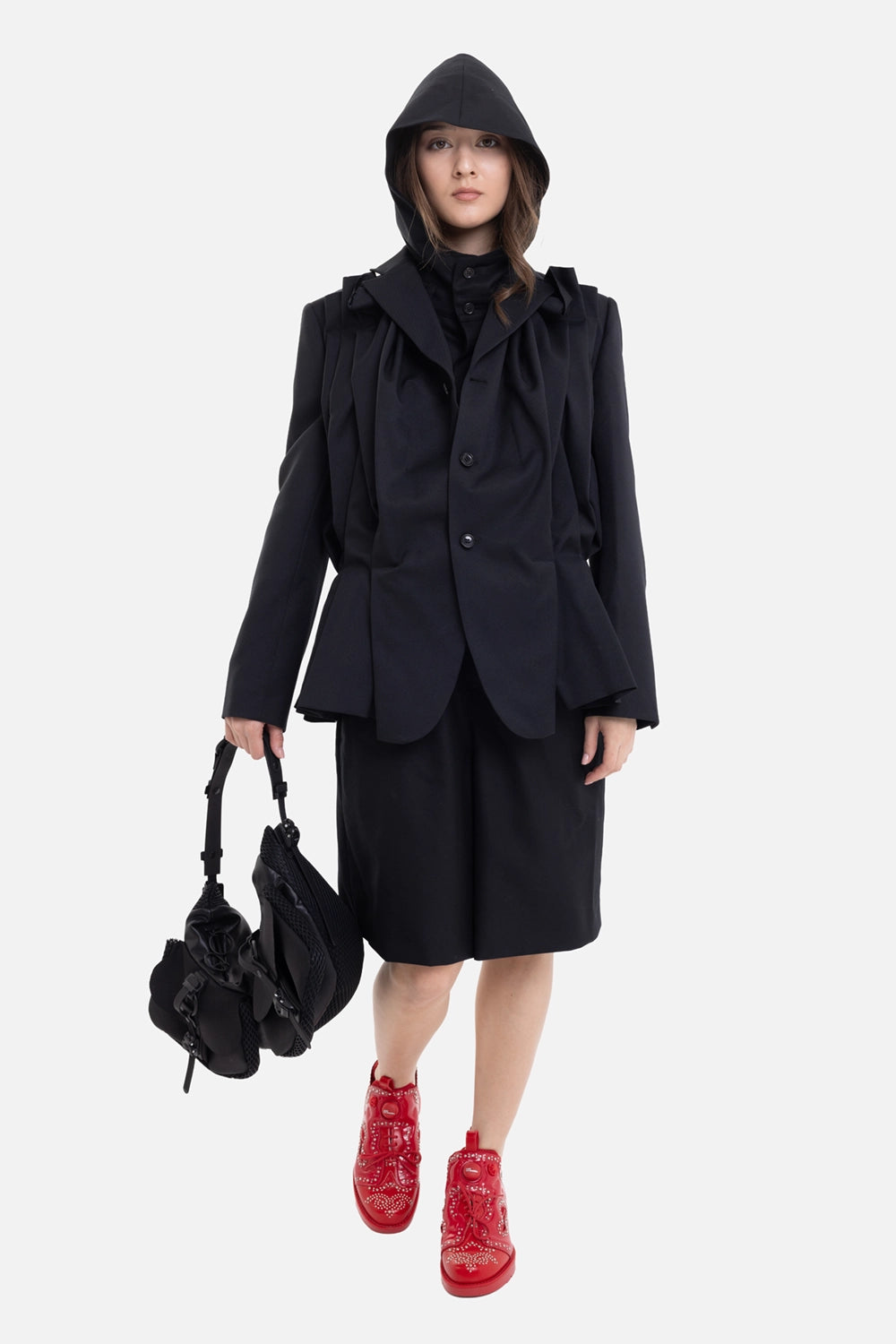 Comme des Garçons women's blazer in Black, on-model full-length view with sculpted hip panels