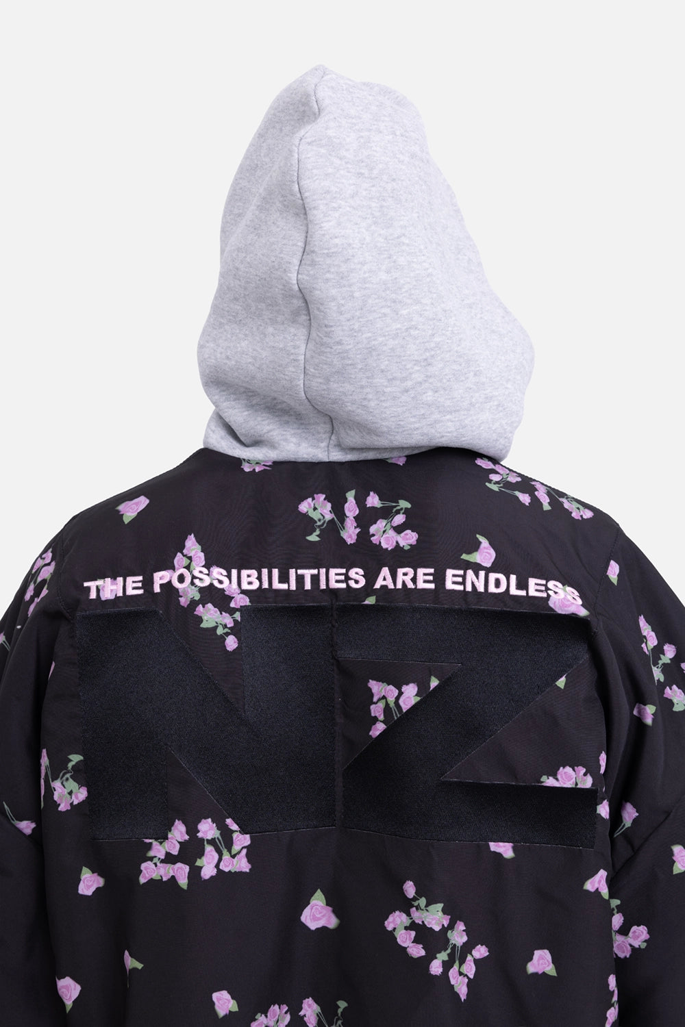 Natasha Zinko reversible bomber jacket in black/grey, back detail, NZ applique with slogan embroidery