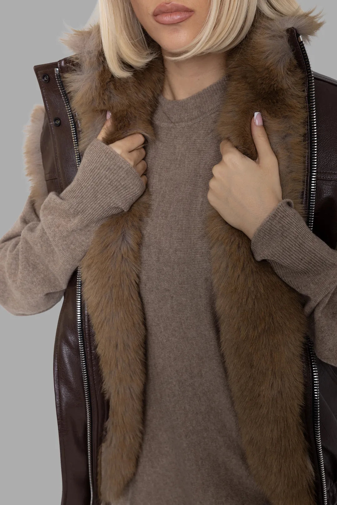 MSGM women's brown reversible faux leather vest, close-up of plush faux-fur lining and zip front detail.