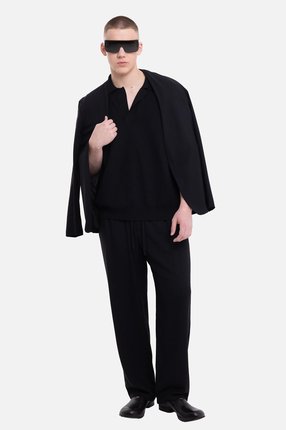 Uma Wang men's polo shirt in black, on-model full-length view with relaxed fit and open collar